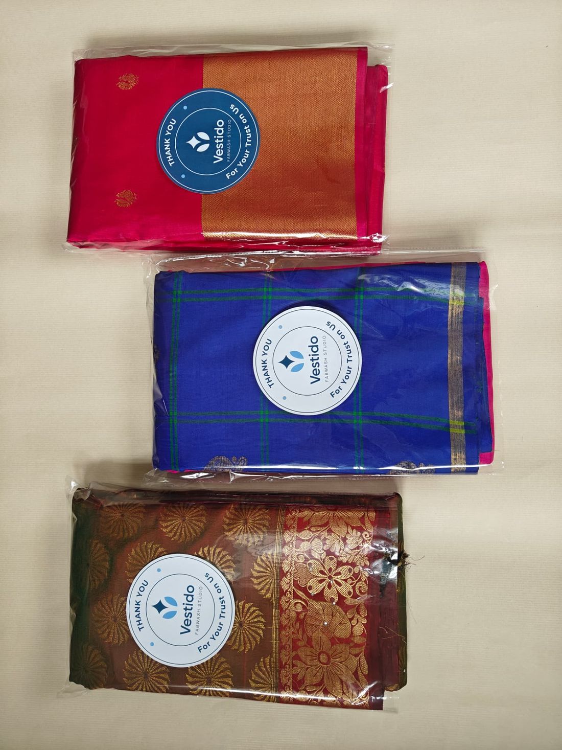 Kanjivaram, Mysore and cotton silk sarees roll polished and neatly stacked