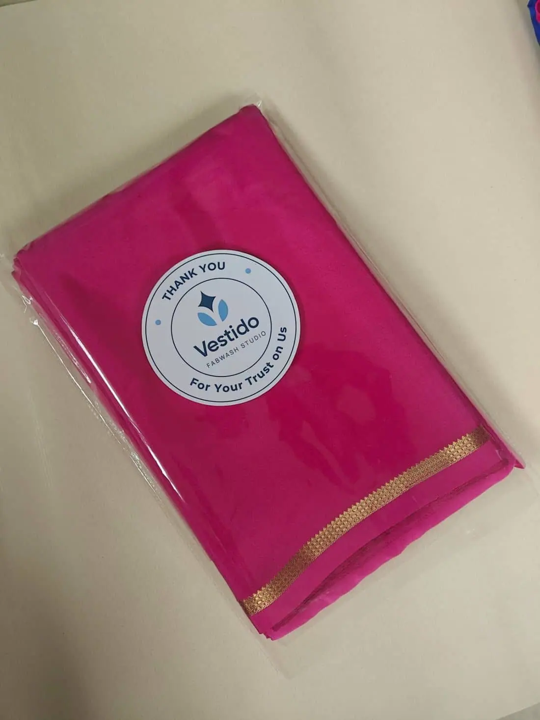 Hand finishing a silk saree border